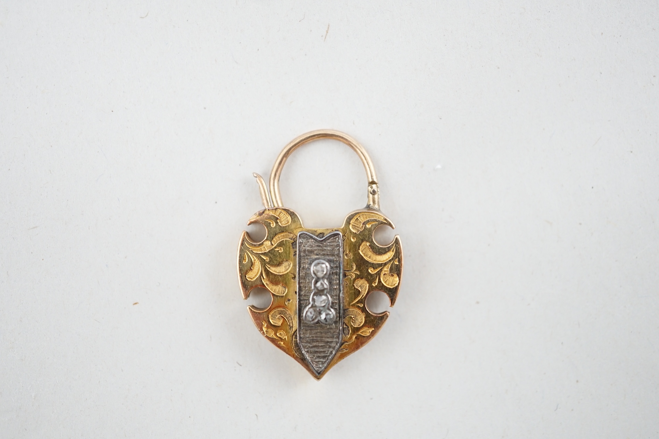 A Victorian engraved gold, carnelian and five stone rose cut diamond set padlock pendant